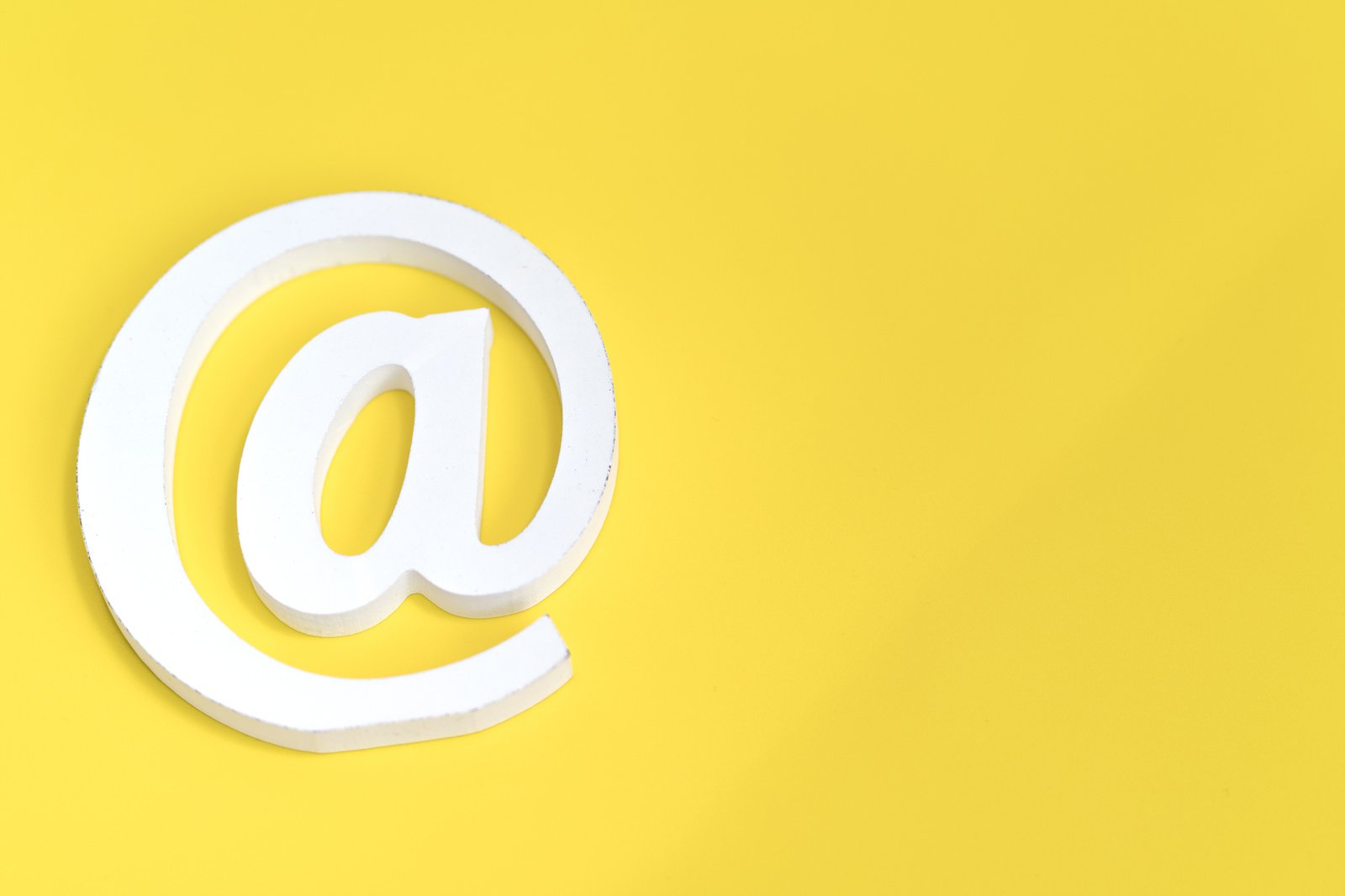 Email symbol on yellow background. Concept for internet, contact us and e-mail address